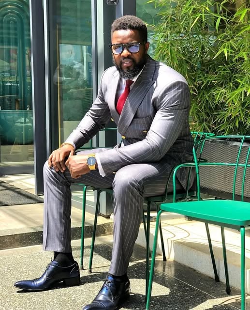Client in a grey pinstripe double-breasted suit
