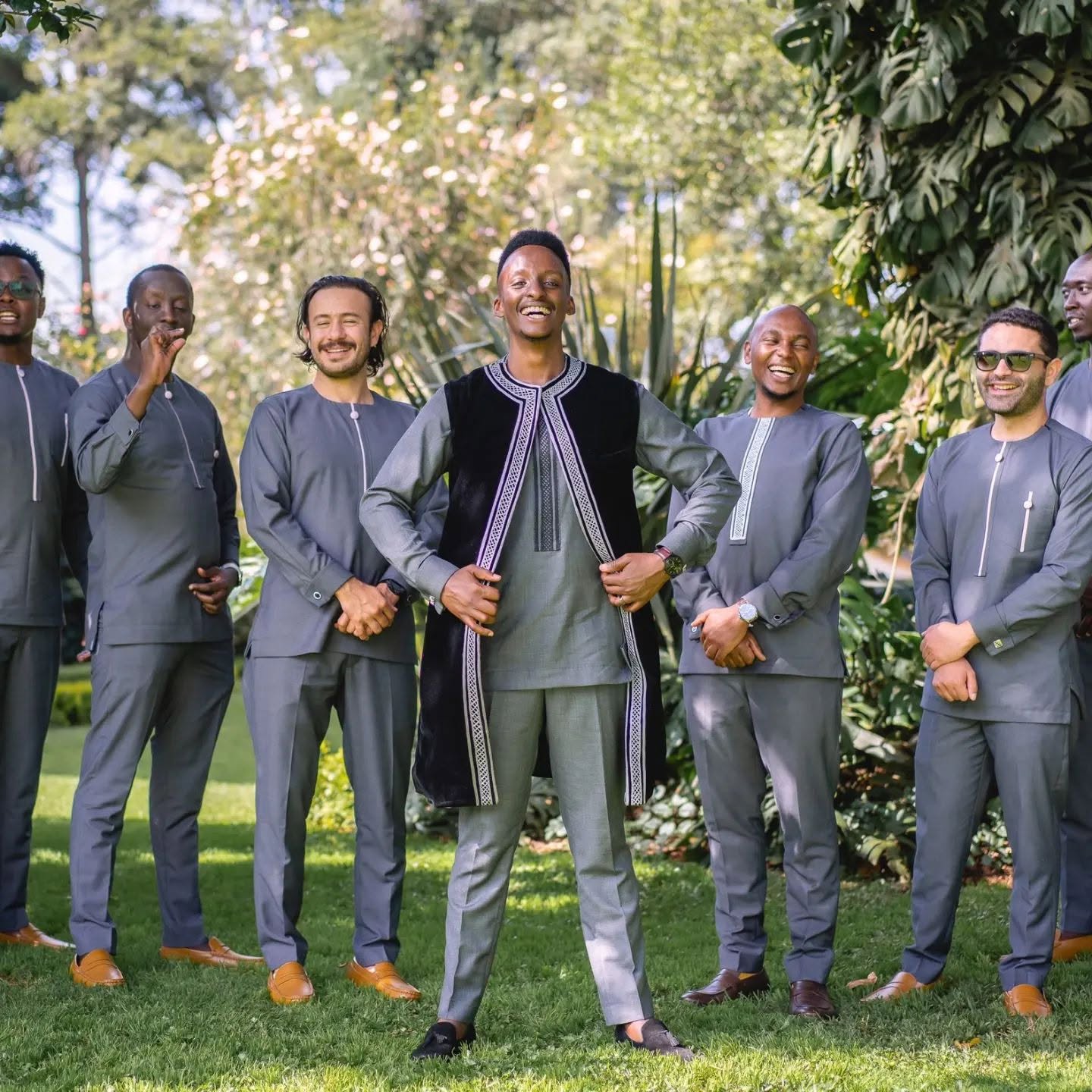 Groom and groomsmen in Ashok grey tailored outfits