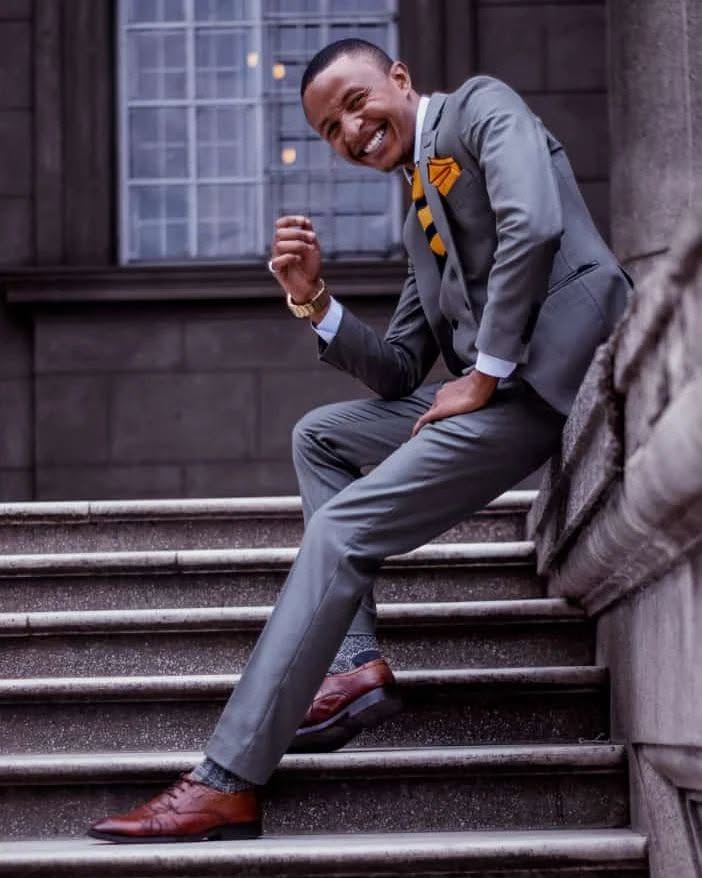 Client in a grey suit on stone steps